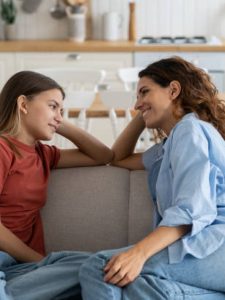 Mother talking with daughter